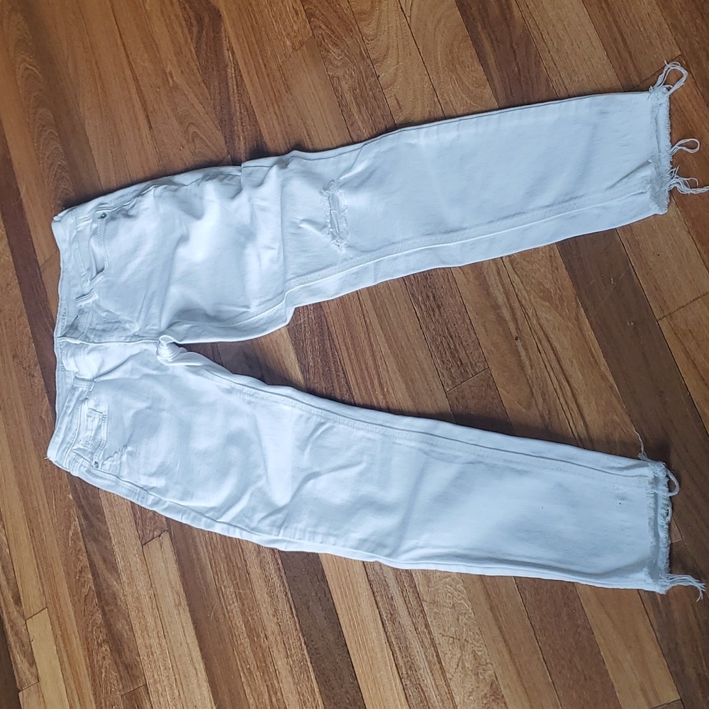 Distressed white jeans